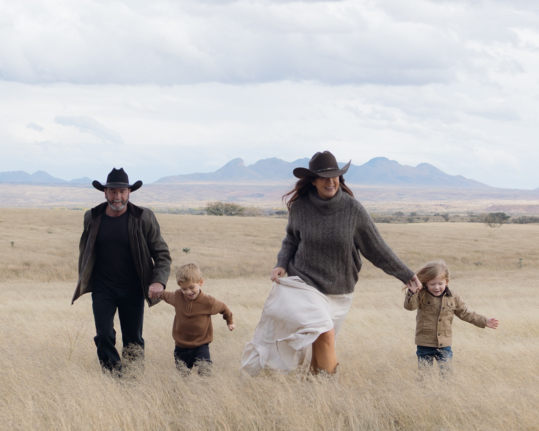 Jason and his family walking together through an open field